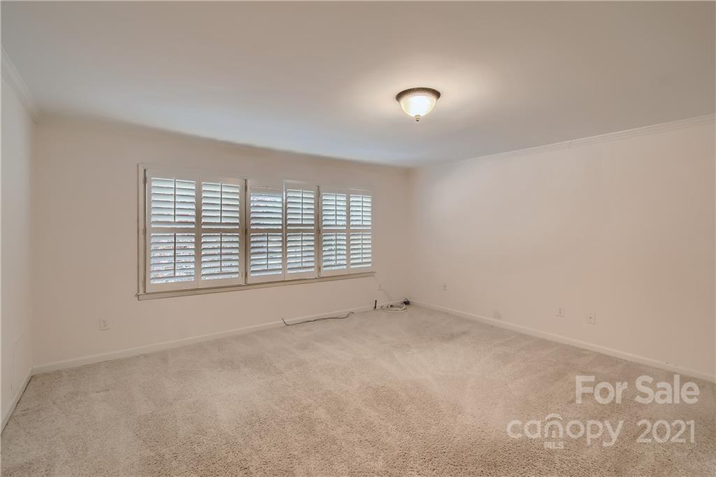 7040 Quail Hill Road Charlotte, NC 28210 - Photo 24 of 33 a view of an empty room with a window
