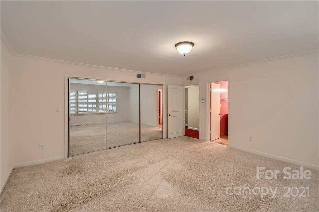 7040 Quail Hill Road Charlotte, NC 28210 - Photo 25 of 33 an empty room with an empty space and windows