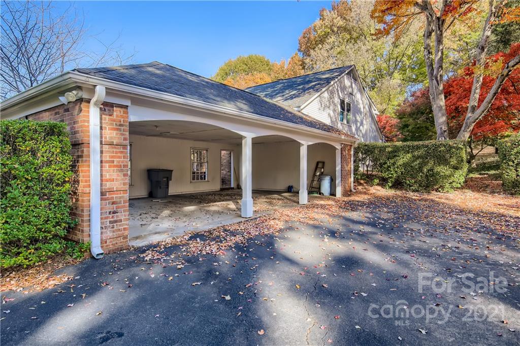 7040 Quail Hill Road Charlotte, NC 28210 - Photo 33 of 33 a view of a house with a yard and large tree