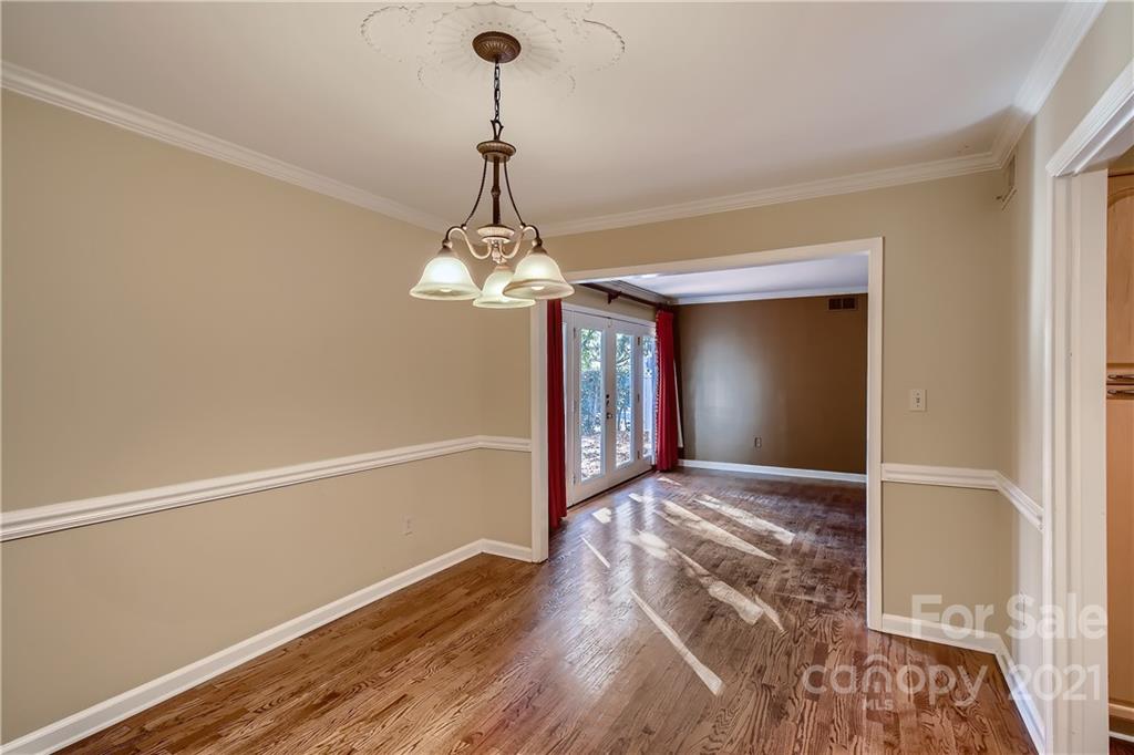 7040 Quail Hill Road Charlotte, NC 28210 - Photo 9 of 33 a view of a chandelier in a room