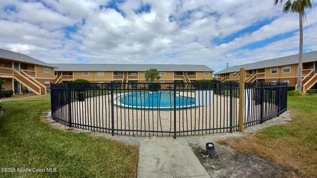 a view of swimming pool having outdoor seating