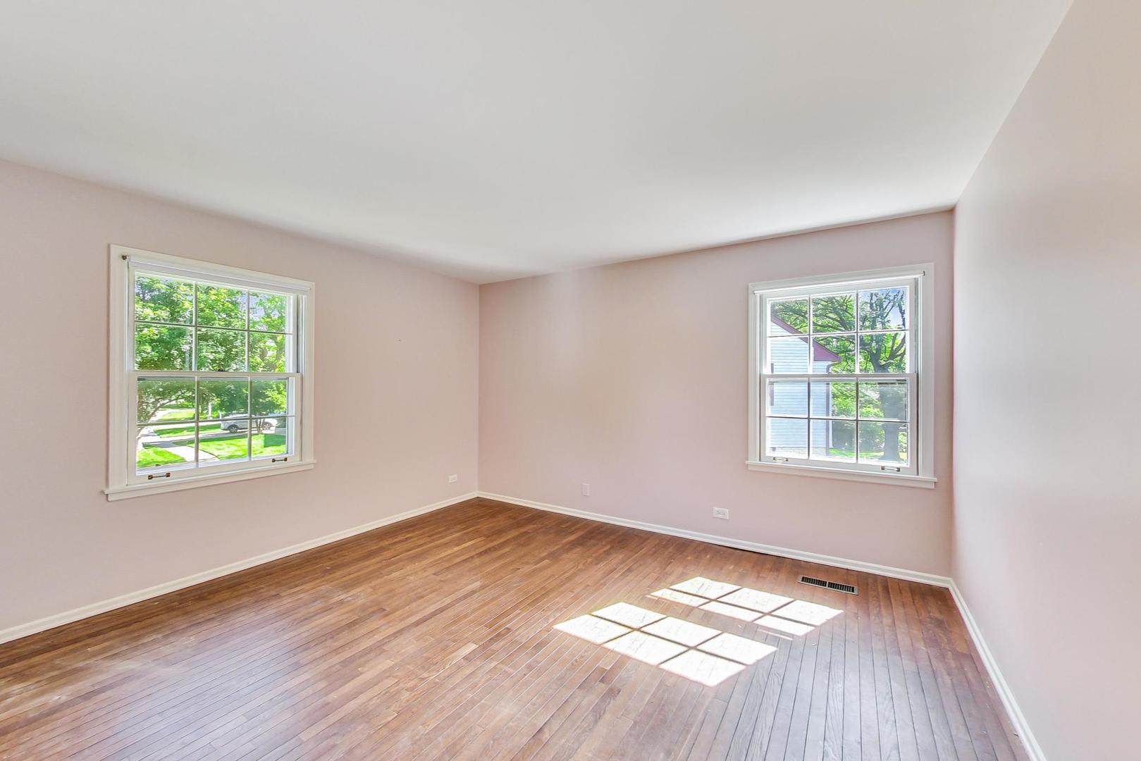 2441 Shannon Road Northbrook, IL 60062 - Photo 17 of 26 a view of an empty room with wooden floor and a window