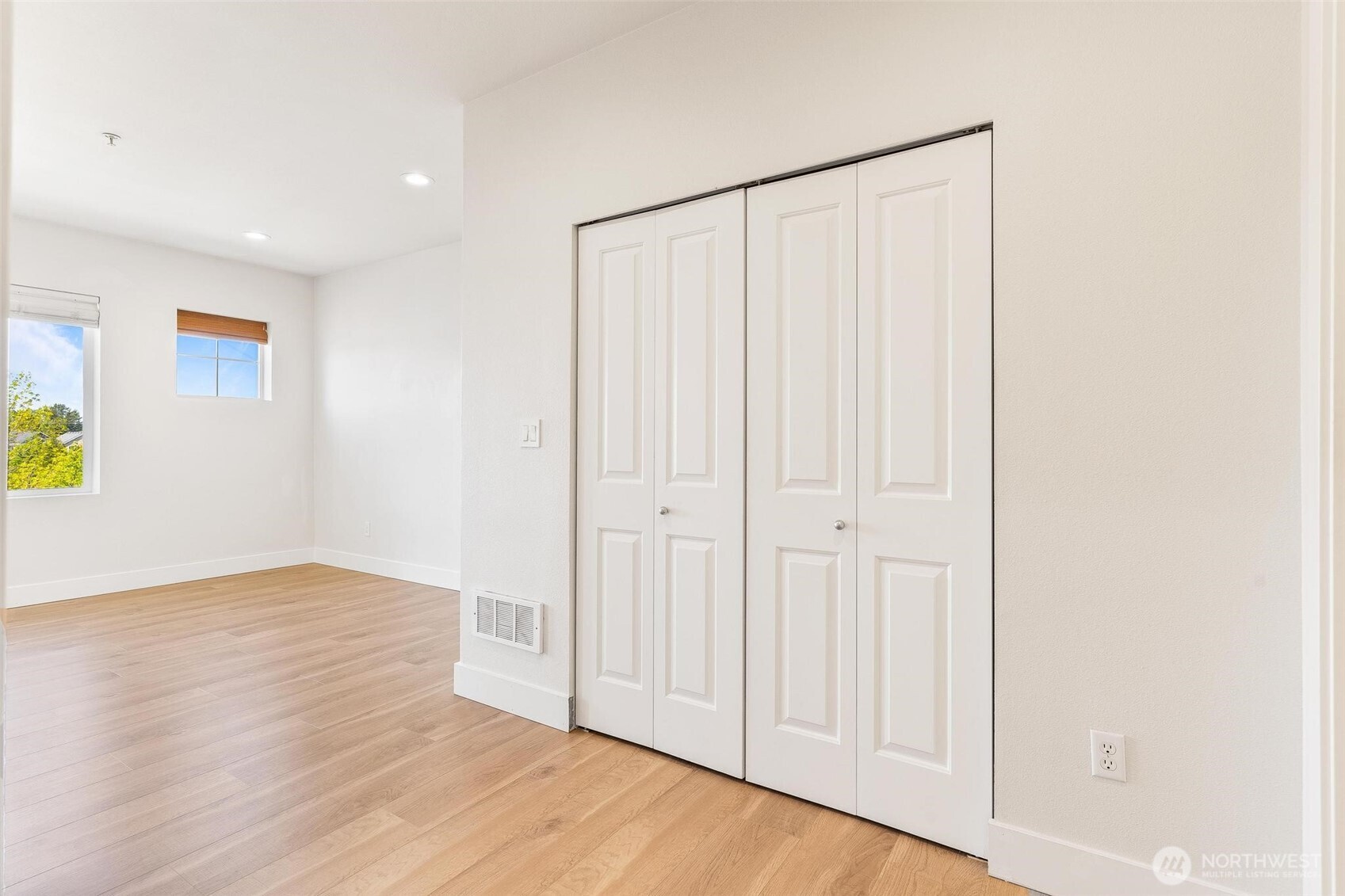 14915 38th Drive Southeast, Unit F3011 Bothell, WA 98012 - Photo 15 of 40 a view of an empty room with wooden floor