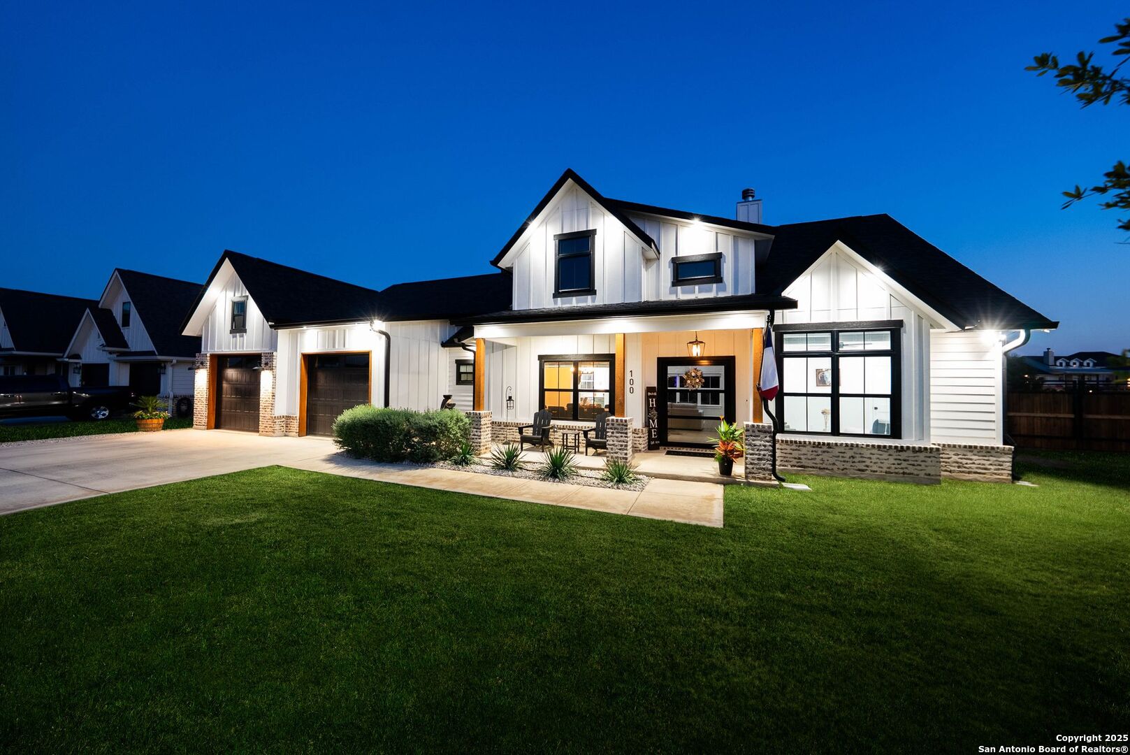 a front view of a house with swimming pool having outdoor seating