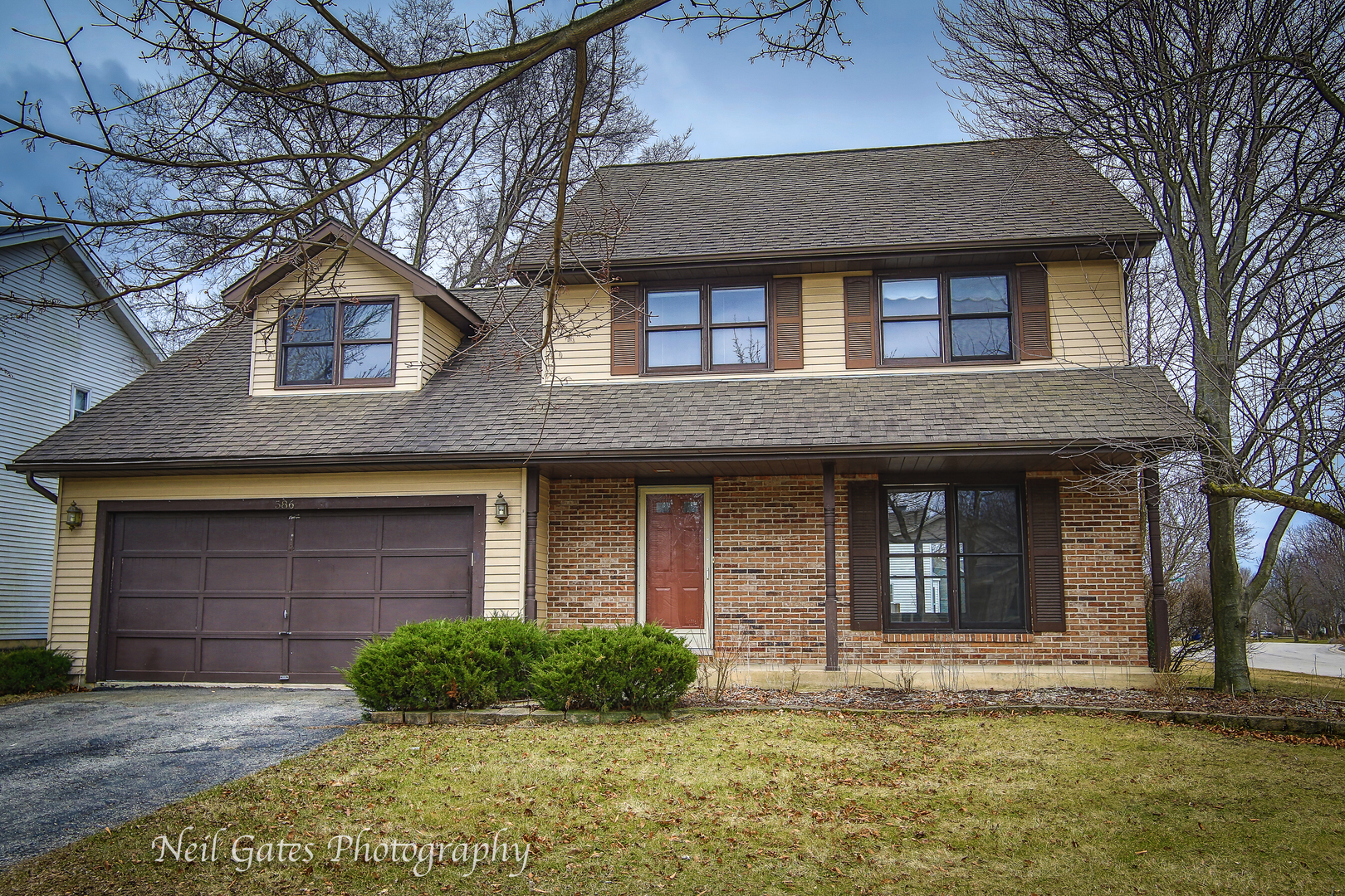 586 Roxbury Drive Naperville, IL 60565 - Photo 1 of 39 a front view of a house with garden