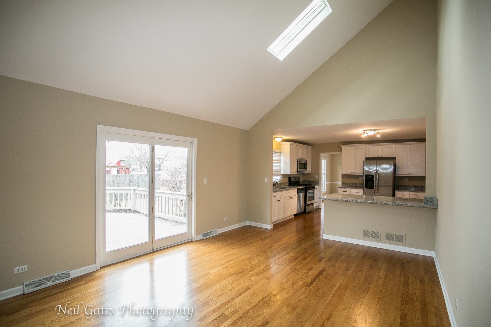 586 Roxbury Drive Naperville, IL 60565 - Photo 11 of 39 a view of a kitchen and dining room with wooden floor