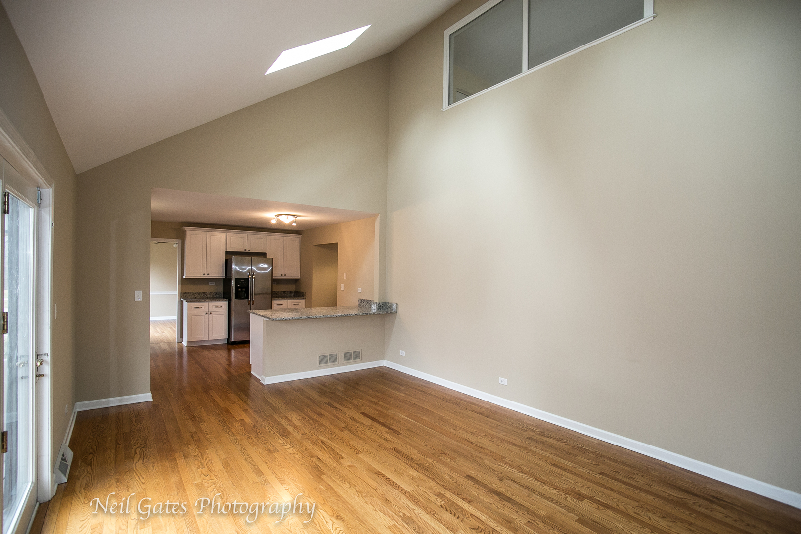 586 Roxbury Drive Naperville, IL 60565 - Photo 13 of 39 a view of a kitchen with wooden floor and a sink