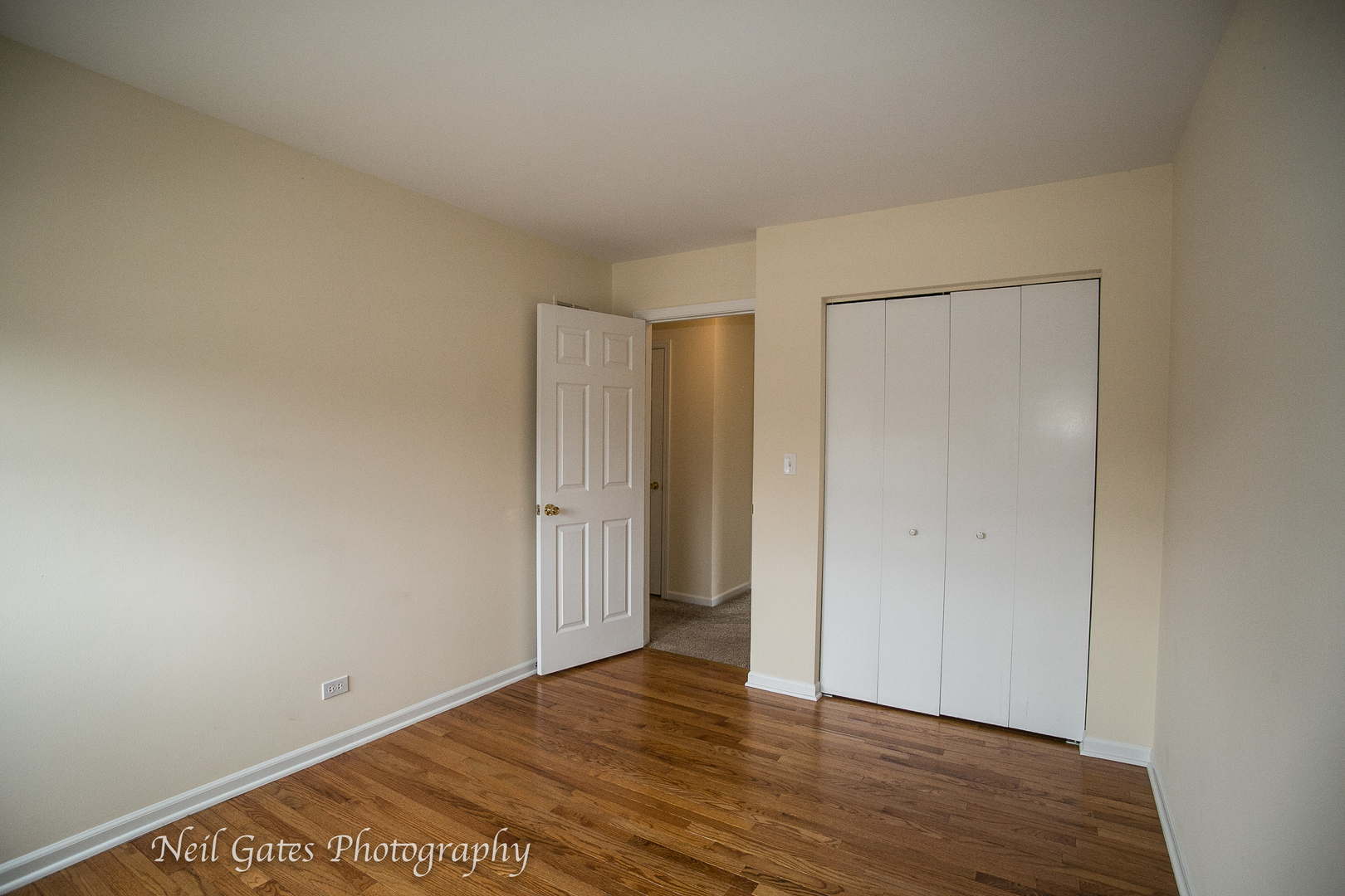 586 Roxbury Drive Naperville, IL 60565 - Photo 23 of 39 a view of an empty room with wooden floor