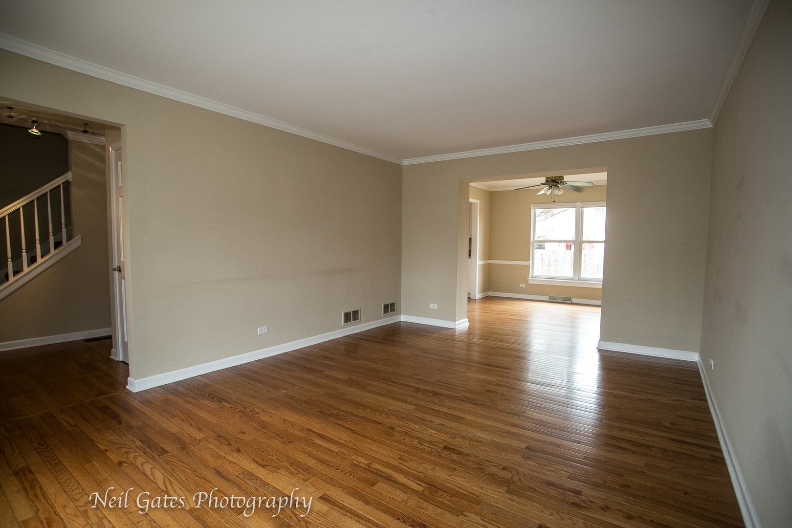586 Roxbury Drive Naperville, IL 60565 - Photo 4 of 39 an empty room with wooden floor and windows