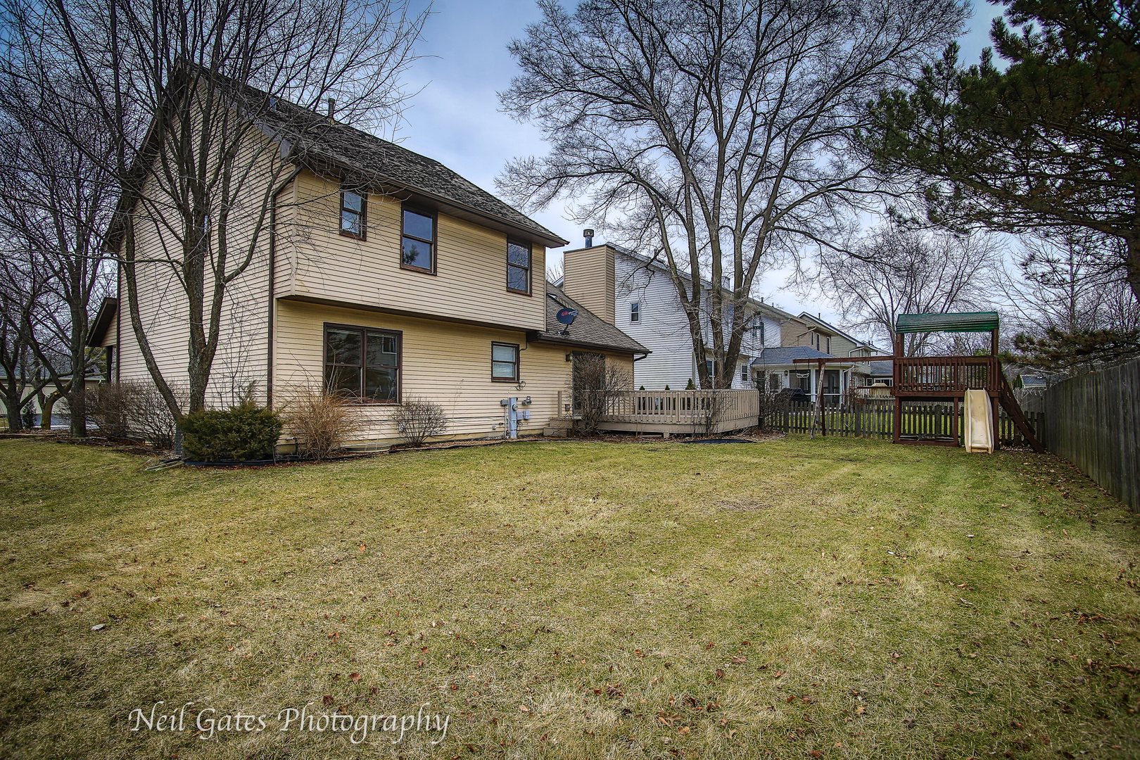 586 Roxbury Drive Naperville, IL 60565 - Photo 37 of 39 a view of a house with a yard