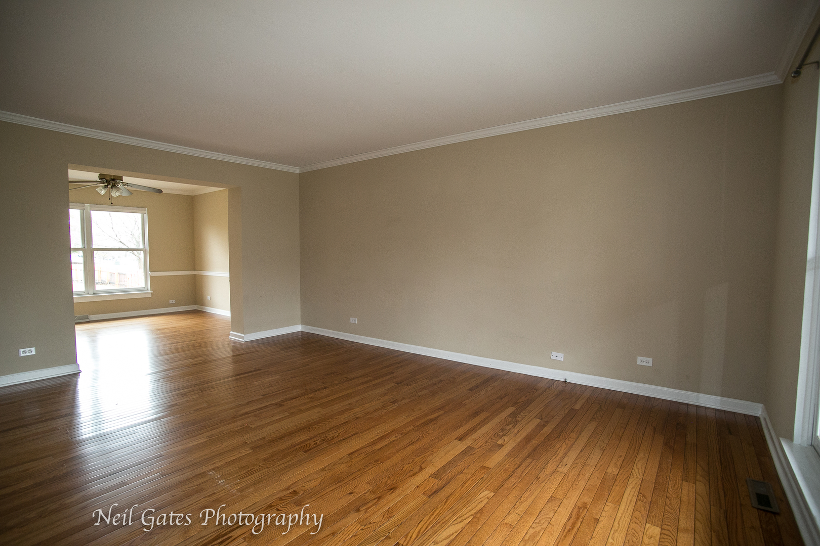 586 Roxbury Drive Naperville, IL 60565 - Photo 5 of 39 wooden floor in an empty room with a window