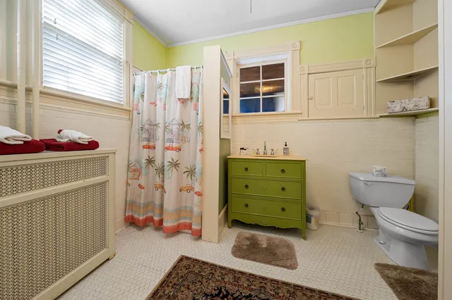 a view of a livingroom with furniture and staircase