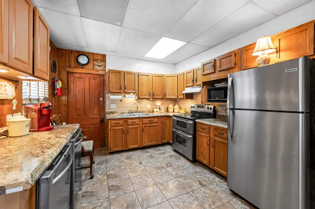 a utility room with closet dryer and washer