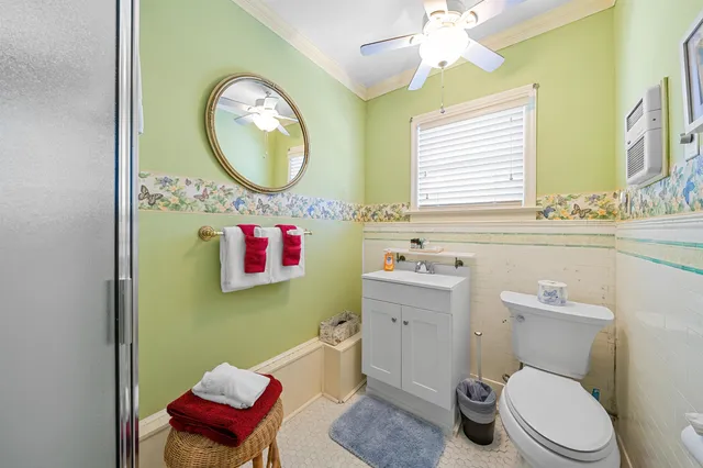 a bedroom with two beds and a chair