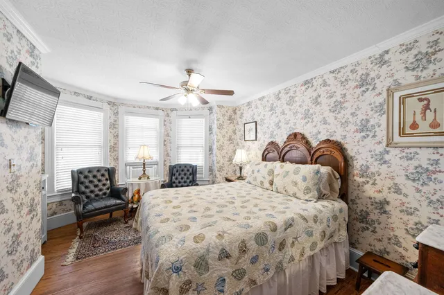 a white toilet sitting next to a bathroom sink