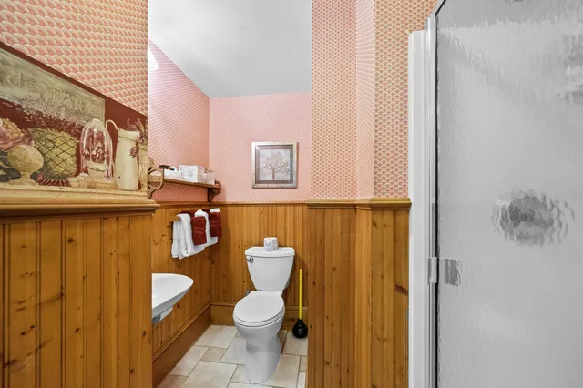 a bedroom with bed and window