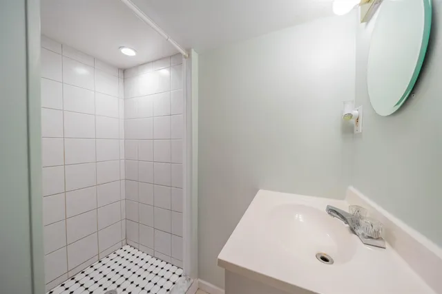 a kitchen with stainless steel appliances granite countertop a sink a stove and cabinets