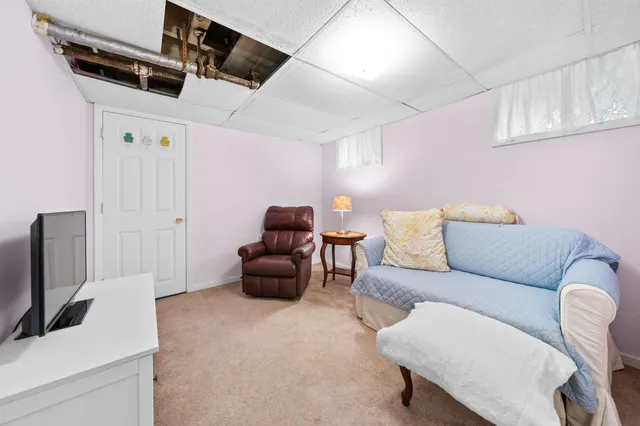 a view of a livingroom with furniture and a fireplace