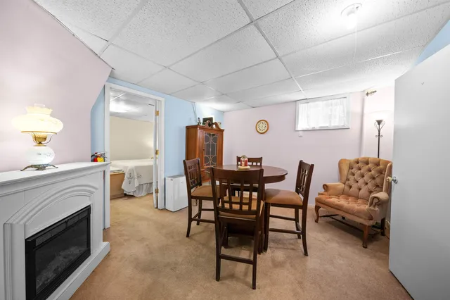 a large bedroom with a bed and furniture