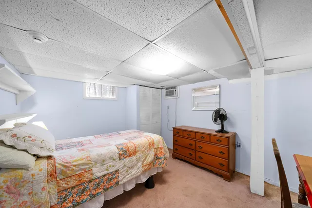 a view of a house with a yard and potted plants