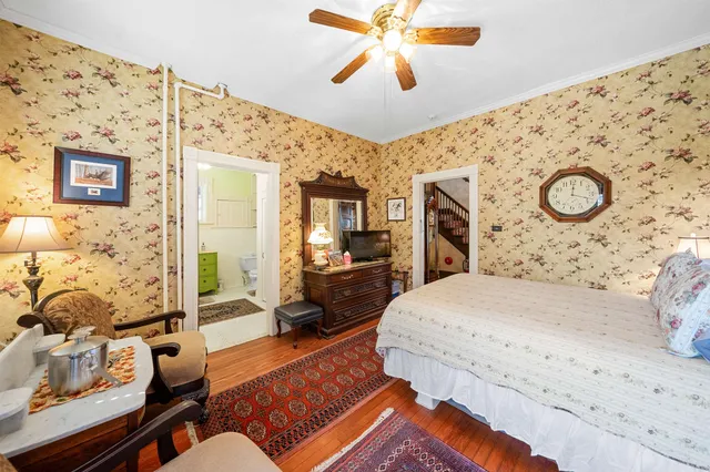 a bathroom with a sink toilet and window