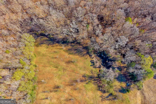 a view of a dining room with furniture and window