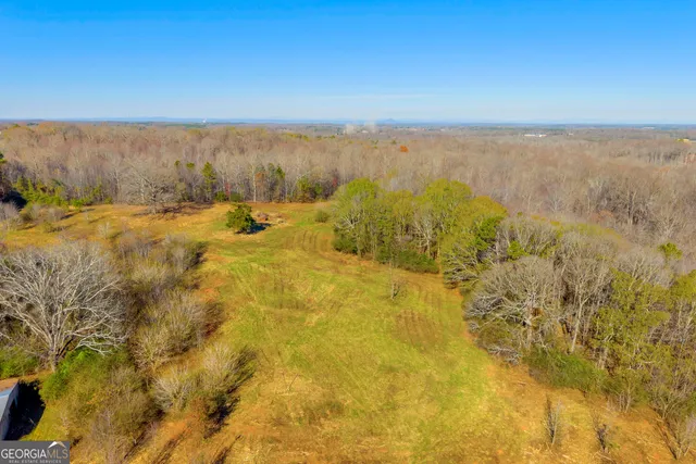 a view of a hallway with a white walls