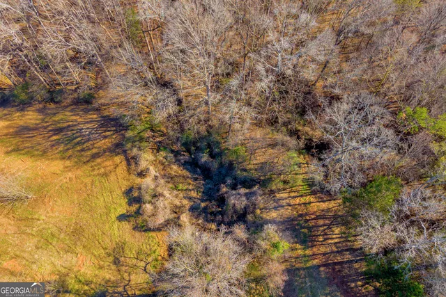 a view of an empty room and a window