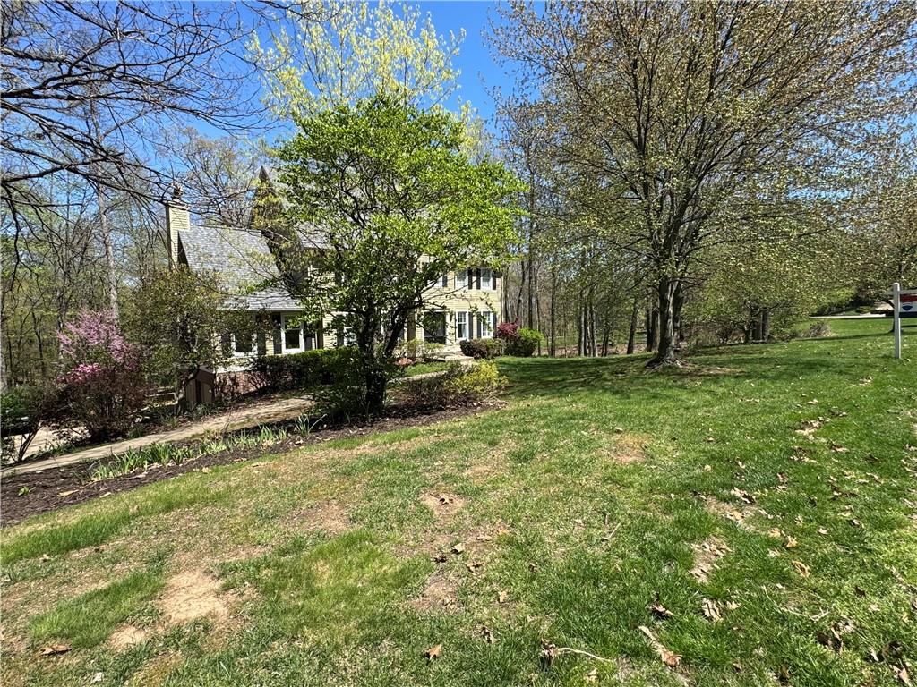 a view of house with outdoor space