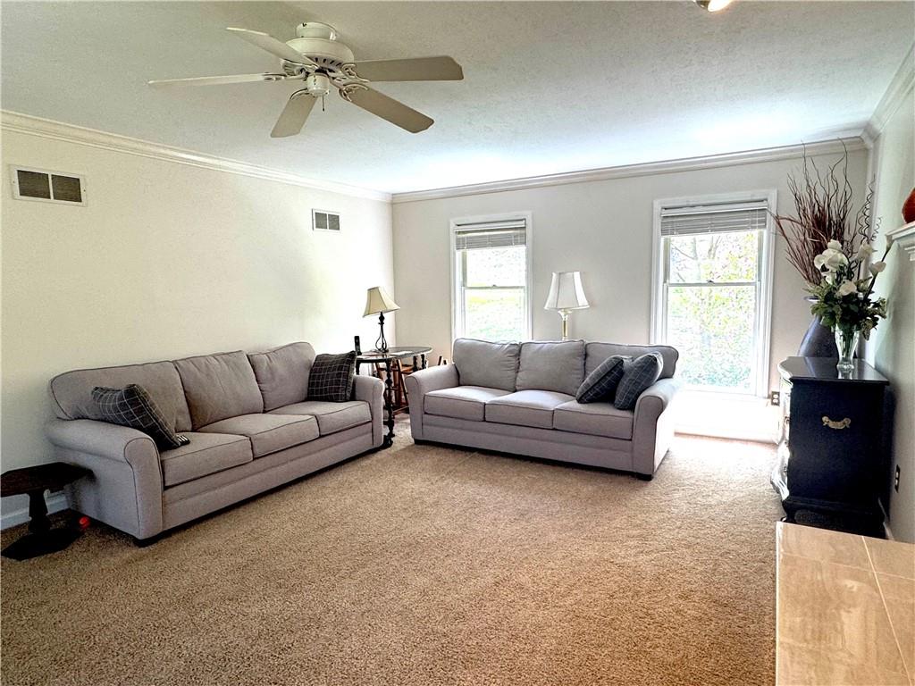 207 Oak Leaf Drive Mars, PA 16046 - Photo 12 of 40 a living room with furniture and a large window