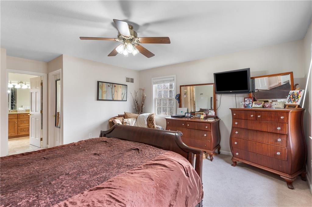 207 Oak Leaf Drive Mars, PA 16046 - Photo 19 of 40 a bedroom with a bed and a flat screen tv