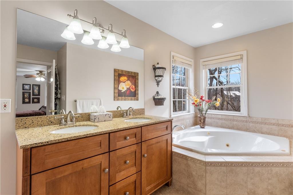 207 Oak Leaf Drive Mars, PA 16046 - Photo 20 of 40 a bathroom with a sink double vanity granite tub and a mirror