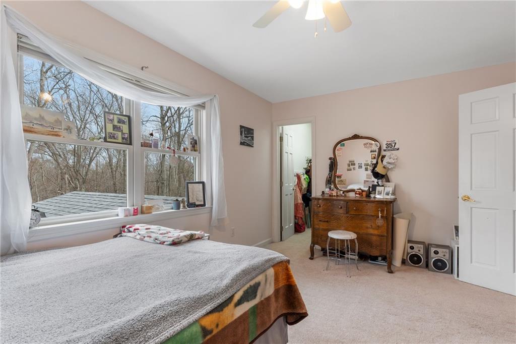 207 Oak Leaf Drive Mars, PA 16046 - Photo 21 of 40 a bedroom with a bed and a chandelier