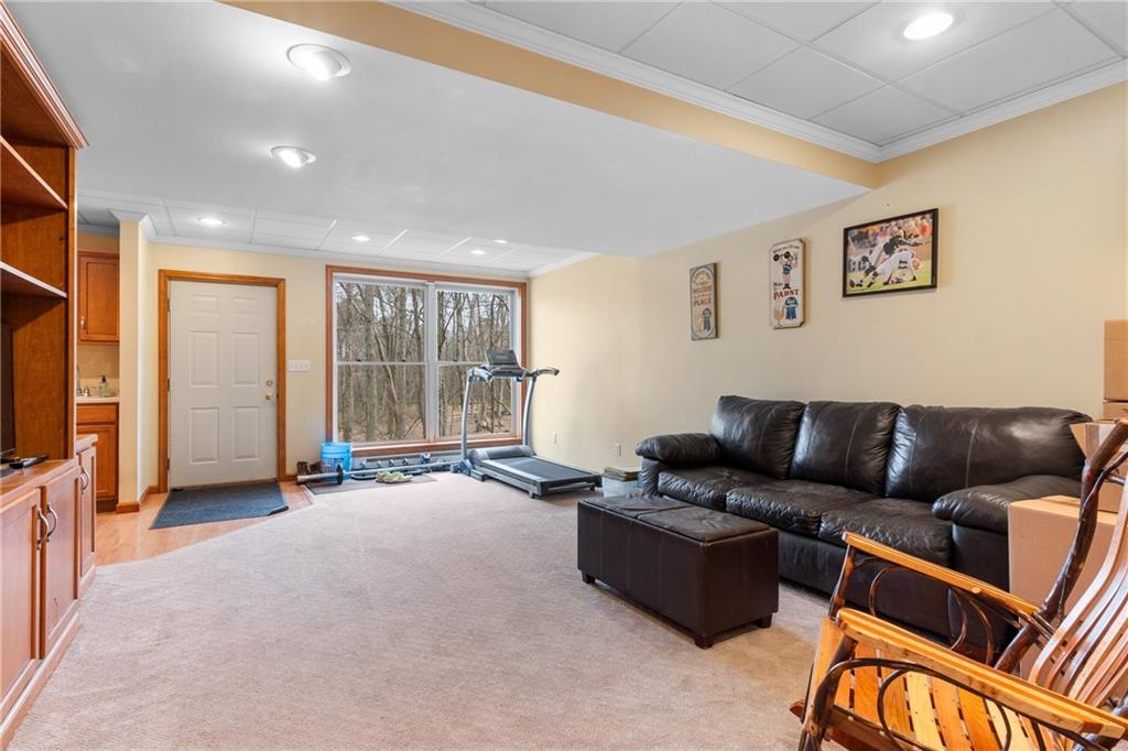 207 Oak Leaf Drive Mars, PA 16046 - Photo 27 of 40 a living room with furniture and a flat screen tv