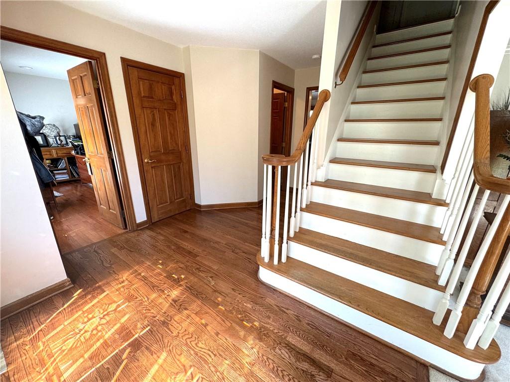 207 Oak Leaf Drive Mars, PA 16046 - Photo 3 of 40 a view of a hallway with wooden floor and staircase