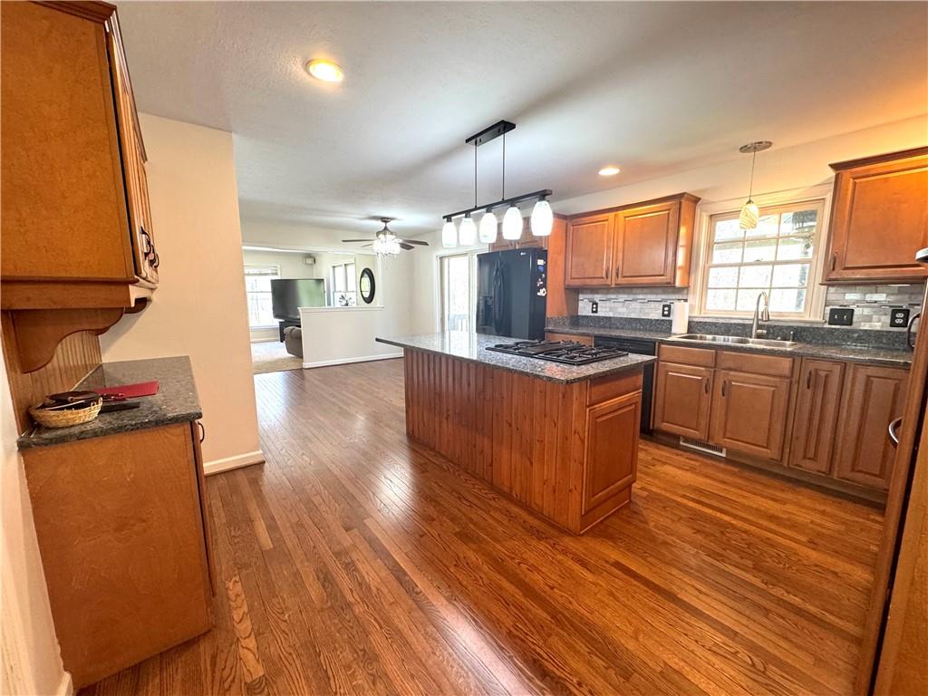 207 Oak Leaf Drive Mars, PA 16046 - Photo 4 of 40 a kitchen with stainless steel appliances granite countertop wooden floors and sink