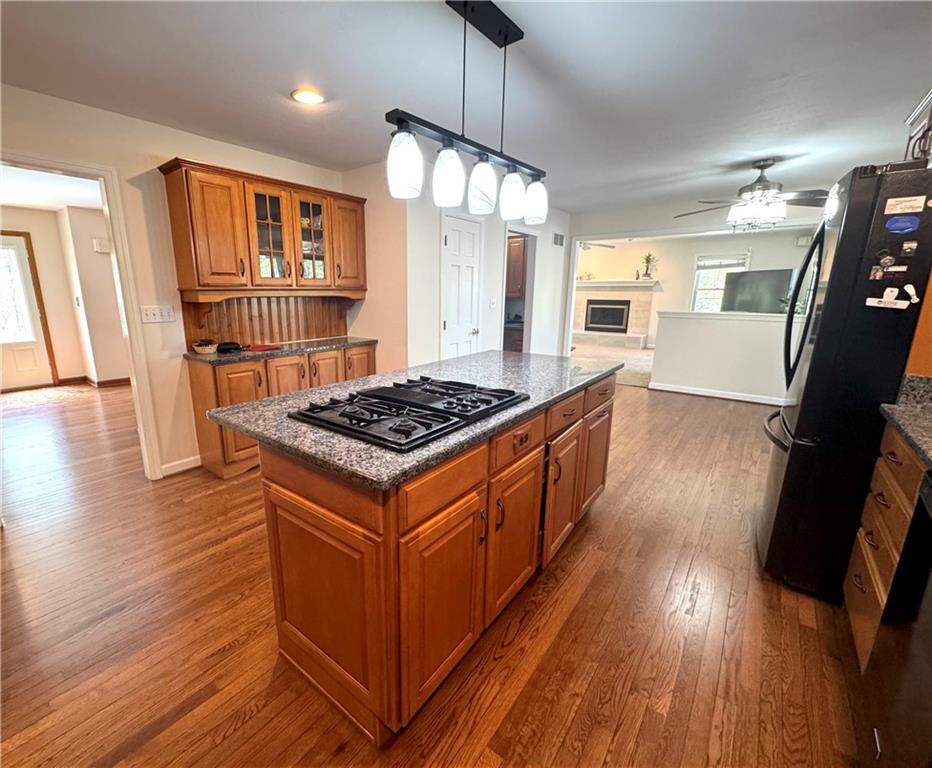 207 Oak Leaf Drive Mars, PA 16046 - Photo 5 of 40 a kitchen with stainless steel appliances granite countertop wooden floors and stove