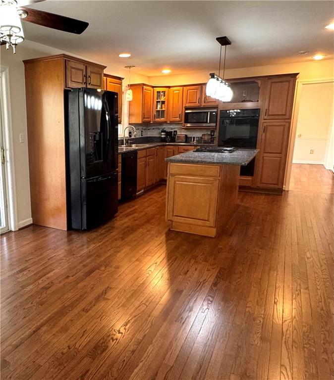 207 Oak Leaf Drive Mars, PA 16046 - Photo 6 of 40 a kitchen with stainless steel appliances kitchen island granite countertop a stove a refrigerator and a wooden floors