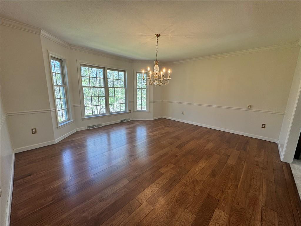 207 Oak Leaf Drive Mars, PA 16046 - Photo 8 of 40 wooden floor in an empty room with a window
