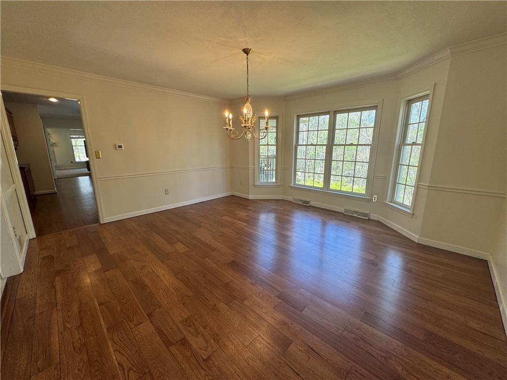 207 Oak Leaf Drive Mars, PA 16046 - Photo 9 of 40 a view of empty room with wooden floor and fan