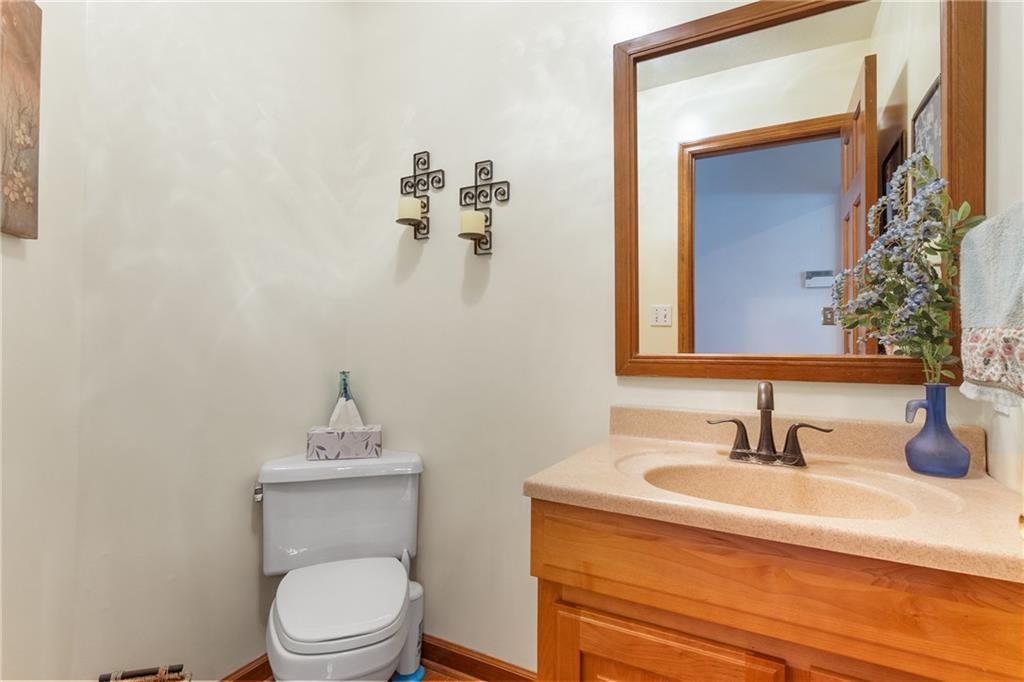 207 Oak Leaf Drive Mars, PA 16046 - Photo 10 of 40 a bathroom with a toilet a sink and mirror