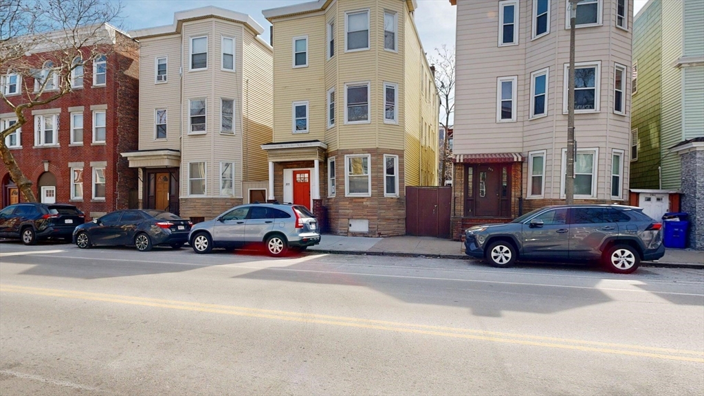 205 Chelsea Street, Unit 2 Boston, MA 02128 - Photo 33 of 33 a cars parked in front of a building