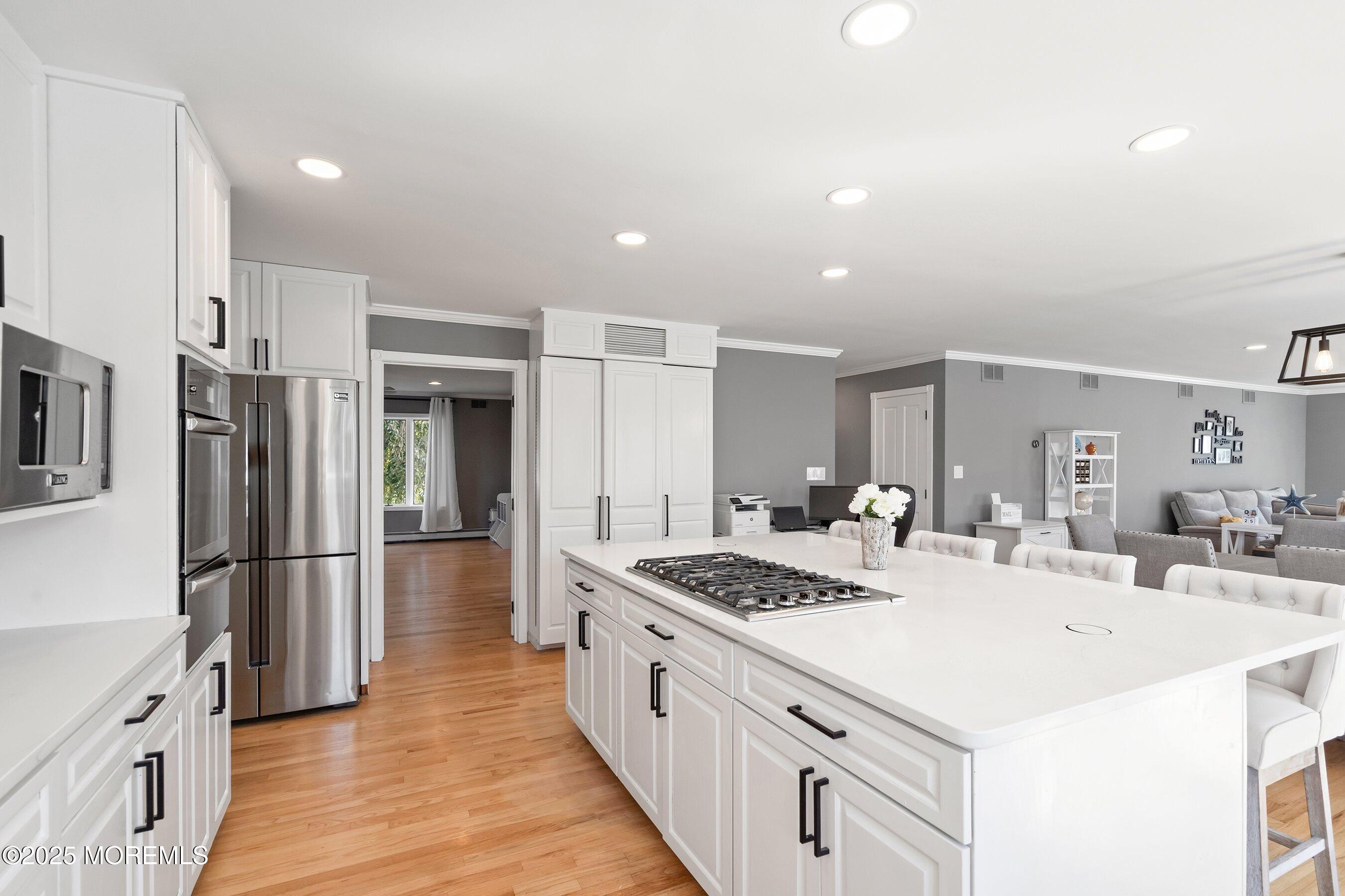 1615 Calamus Place Point Pleasant, NJ 08742 - Photo 14 of 62 a kitchen with stainless steel appliances kitchen island granite countertop a sink stove and refrigerator