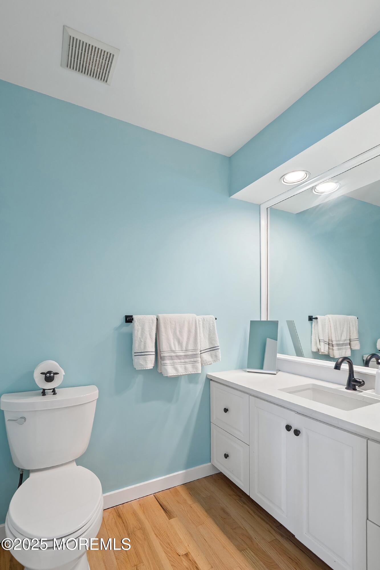 1615 Calamus Place Point Pleasant, NJ 08742 - Photo 24 of 62 a bathroom with a toilet sink and mirror