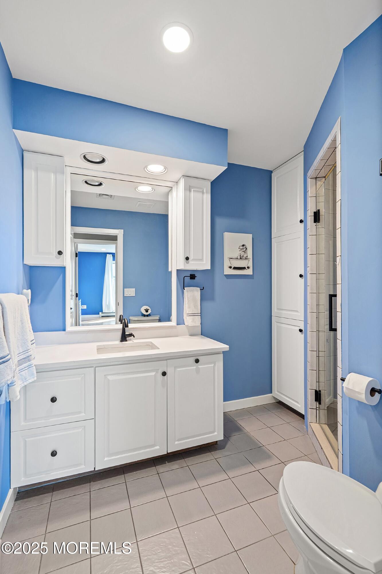 1615 Calamus Place Point Pleasant, NJ 08742 - Photo 28 of 62 a spacious bathroom with a double vanity sink a mirror and a toilet