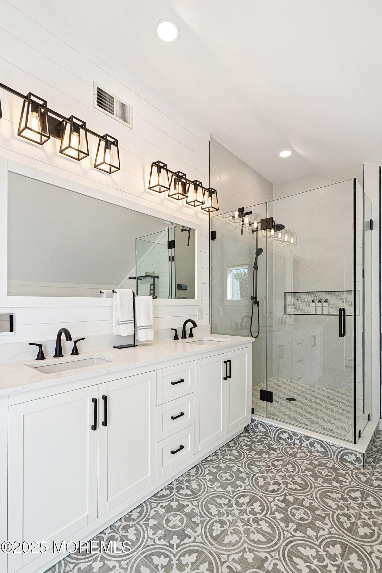 1615 Calamus Place Point Pleasant, NJ 08742 - Photo 31 of 62 a spacious bathroom with a sink a mirror and shower