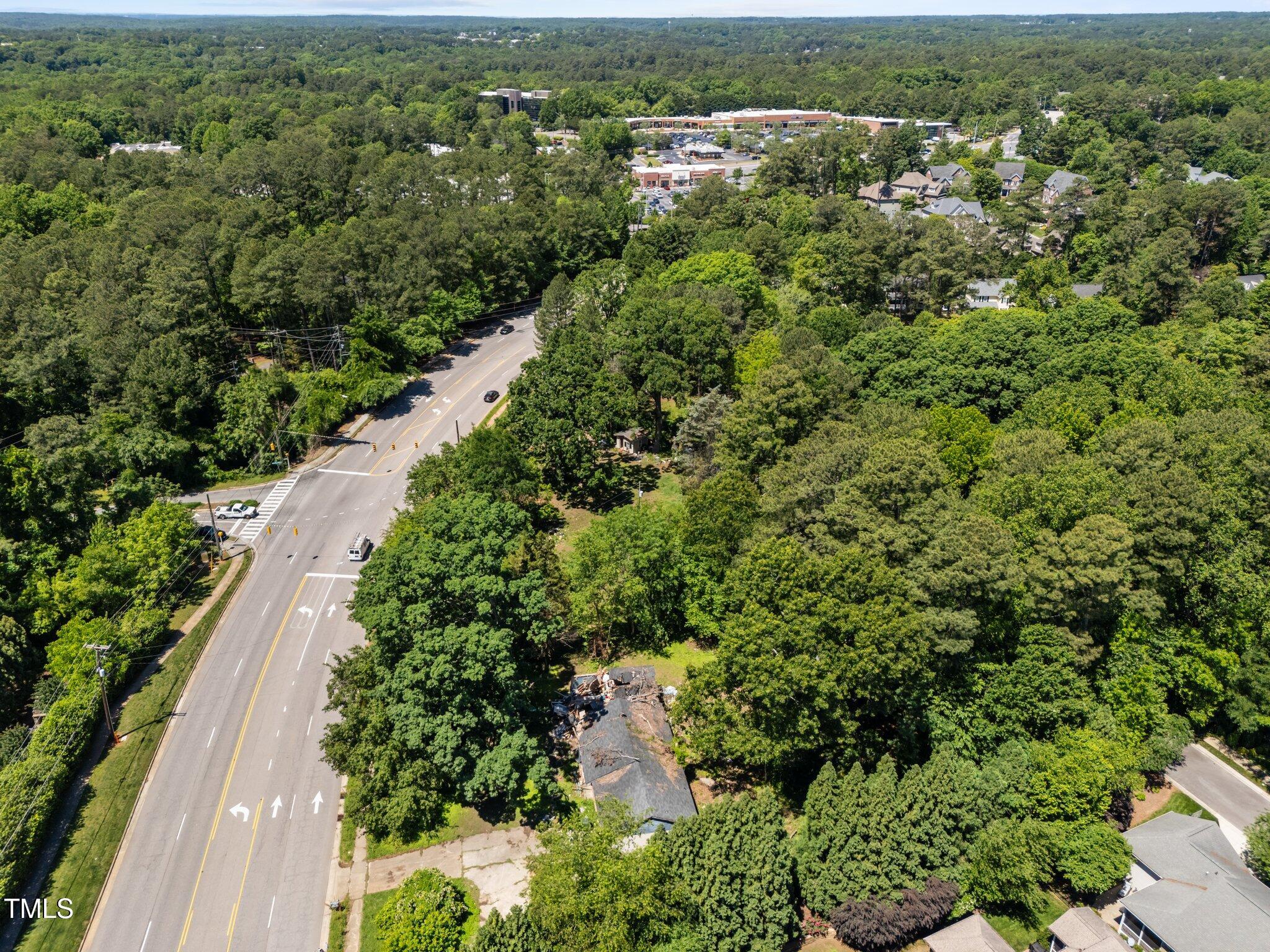 1910 West Millbrook Road Raleigh, NC 27612 - Photo 2 of 8 an aerial view of residential house with outdoor space and trees