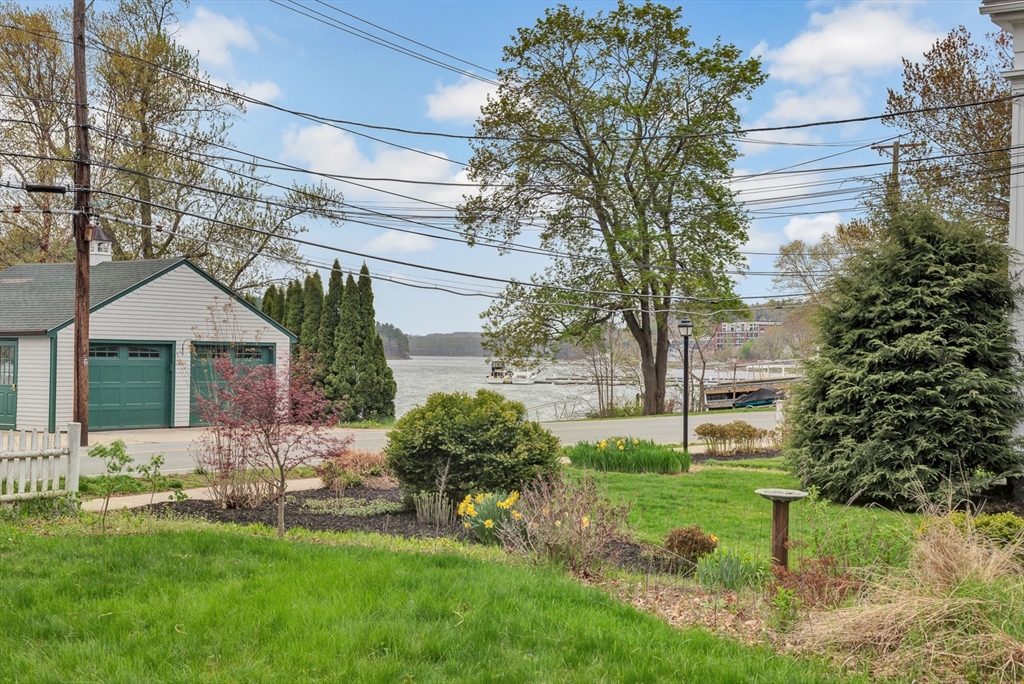 382 Main Street Amesbury, MA 01913 - Photo 14 of 42 a view of a house with a yard and sitting area