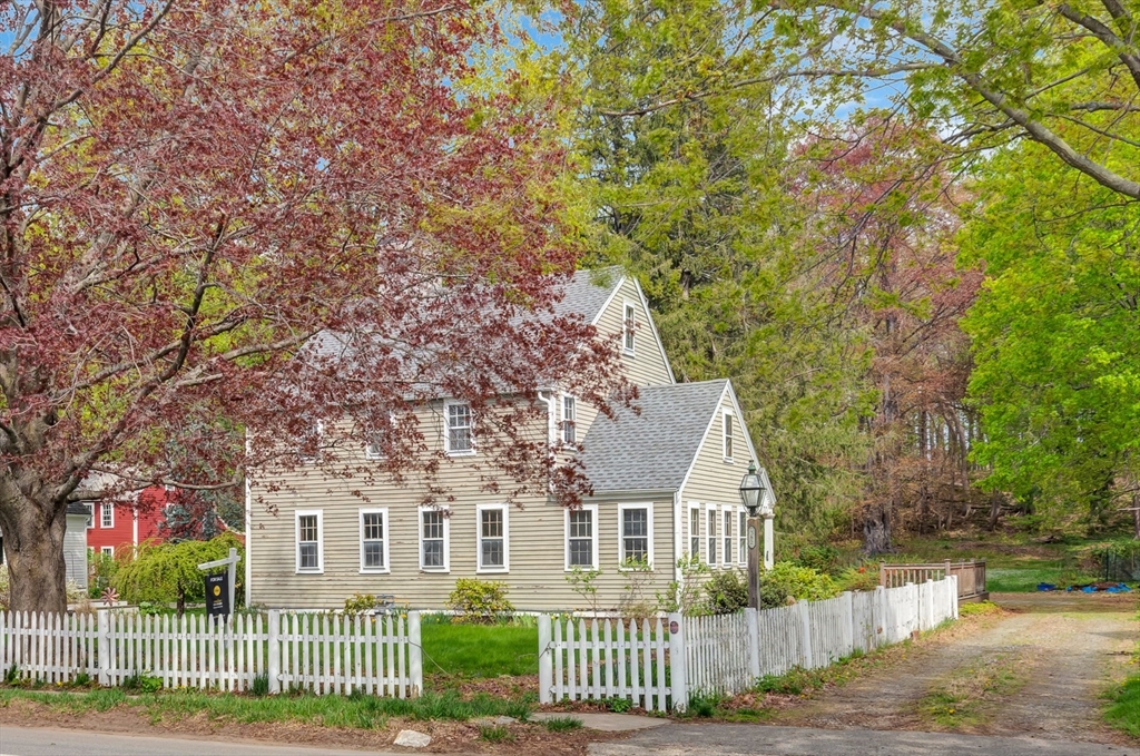 382 Main Street Amesbury, MA 01913 - Photo 7 of 42 front view of a house with a yard