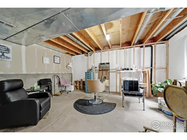 a kitchen with furniture and a fireplace